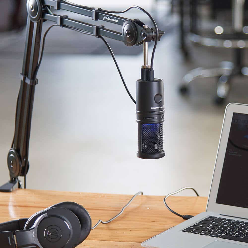 2020USB-X Cardioid Condenser USB Microphone mounted to boom arm with laptop and headphones