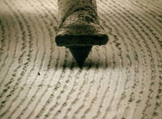 Close-up of stylus tip in record groove